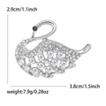 Silver swan brooch with sparkling crystals and size measurements in 3.8cm width - Silver