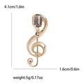 Spilla nota musicale dorata con chiave di violino e microfono, misura 4,1 cm x 1,6 cm - Oro