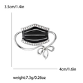 Broche masque créative avec émail noir et strass étincelants sur finition argentée - Noir