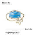 Blue enamel face mask brooch with sparkling rhinestones and a small gold bow accent - Dark Blue