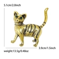 Spilla vintage a forma di gatto in lega dorata con strisce nere e occhi in gemma verde - Oro Antico