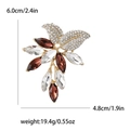 Elegant leaf crystal brooch with brown and clear rhinestones on a gold-plated base - Brown