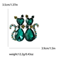 Dark green crystal twin cats brooch with detailed heart-shaped gems and gold accents - Green (MM-BR-1359-GN)