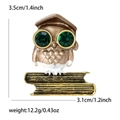 Detailed view showing owl brooch dimensions 3.5cm by 3.1cm with green rhinestone eyes - Brown