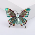 Broche de mariposa vintage con alas de esmalte de colores y una piedra preciosa verde - Verde
