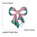 Dimensioni spilla a fiocco: altezza 4,5cm, larghezza 3,9cm, con glitter e perla - Blu