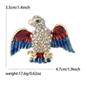 Golden alloy eagle brooch with colorful enamel wings and crystal rhinestones - Blue