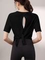 Haut de yoga noir pour femme avec dos ouvert ajouré et détail de nœud élégant - S / Noir