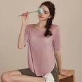 Pink yoga t-shirt with cross-strap neckline and olive green cycling shorts - Dusty Pink