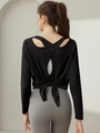 Top yoga nero a maniche lunghe con incrocio sulla schiena e dettaglio fiocco elegante - M / Nero