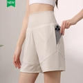 Women's cream white high waisted nylon sports shorts with side pockets for fitness - Beige