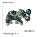 Sparkling elephant brooch in silver finish with emerald green rhinestones and crystals - Green (1777-GN)