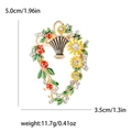 Elegant flower basket brooch with red berries and yellow sunflowers in gold finish - Multicolor (MM-BR-1599)