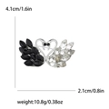 Broche cygne en cœur avec strass noirs et blancs et indications de dimensions - Noir