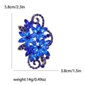 Spilla vintage con fiori di cristallo blu e dettagli a volute in lega di bronzo - Blu