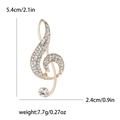 Elegant gold musical note brooch with sparkling rhinestones and crystal accents - Gold