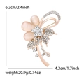 Elegant cat eye stone flower brooch in rose gold with rhinestone accents and dimensions - Rose Gold