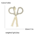Elegante spilla a forbice dorata con strass scintillanti e piccole perle bianche - Oro