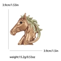 Antique gold horse head brooch with green mane, measuring 3.9cm by 3.9cm - Bronze