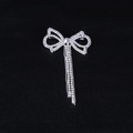 Elegant rhinestone bow brooch with shimmering tassels for women's blazer accessories - Silver