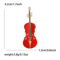 Elegante broche de violín en esmalte rojo y metal dorado con dimensiones y peso indicados - Forma de Violín (MM-BR-1324) / Rojo (Borde Dorado)