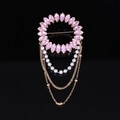 Detailed view of luxury gold ring brooch with pink crystals and pearl tassel decoration - Pink