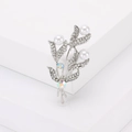 Elegant floral leaf brooch with white pearls and sparkling rhinestones on silver plating - Silver