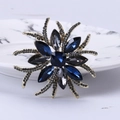 Broche de estrella vintage con cristales azules y piedras negras en metal dorado - Azul