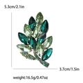 Green crystal leaf alloy brooch with rhinestone detail showing dimensions 5.3x3.7cm - Green