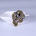 Vintage style brooch in antique gold finish with grey rhinestones and pear cut stone - Gold