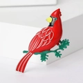 Elegant red cardinal bird brooch pin with green rhinestone eye on white background - Red