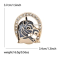 Detail view of unicorn brooch with enamel finish and rhinestone horseshoe frame - Gray