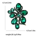 Spilla vintage con cristalli verde smeraldo in lega d'oro scuro con dimensioni - Verde