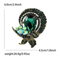 Elegante broche dorado con cristal gota verde esmeralda y pequeñas gemas de gotas de agua - Verde