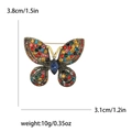 Kleurrijke vlinderbroche van legering met blauwe edelsteen, variant van 3,8 cm breed - Multicolor (2063-MX)