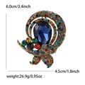 Vintage alloy brooch with blue teardrop gemstone and multicolored rhinestones - Colorful