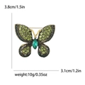 Vintage gouden vlinderbroche met smaragdgroene strassteentjes en afmetingen in het beeld - Groen (2063-GN)