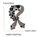 Silver bow brooch with blue rhinestones and dimensions 5.2cm by 3.4cm on white background - Blue