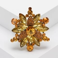 Elegante Blumenbrosche mit bernsteinfarbenen Kristallen und Strass in Vintage-Gold - Gelb