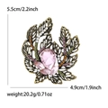 Detail view showing dimensions of vintage leaf brooch with pink gemstone and crystals - Pink