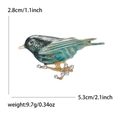 Teal and green enamel bird brooch with golden base and crystals measuring 5.3cm x 2.8cm - Blue