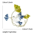 Enamel dove brooch with blue marbling and ginkgo leaf, dimensions 4.4cm by 3.9cm - Blue