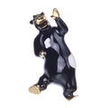 Cartoon cow enamel pin in black and white with gold trim and green rhinestone eyes - Black