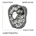 Detail view of vintage rhinestone brooch with 5.5x4.3cm size and 18.0g weight specs - Black