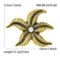 Golden starfish brooch for suits featuring wave texture and crystal center, 4.8cm wide - Gold