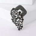 Vintage dark grey alloy brooch with teardrop crystals and pavé rhinestones on white block - Black