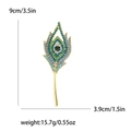 Peacock feather brooch with blue rhinestones and gold alloy base in 9cm size - Blue