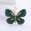 Primer plano de broche de mariposa de lujo con cristales brillantes en degradado azul y verde - Verde (1987)