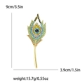 Peacock feather brooch in gold alloy with colorful rhinestones, 9cm x 3.9cm size - Green