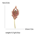 Vintage gold peacock feather brooch with colorful rhinestones 9cm x 3.9cm size guide - Pink